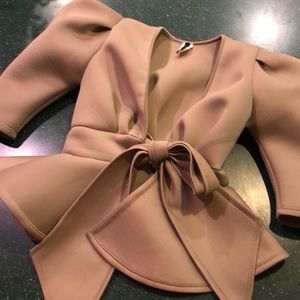 Nude peplum top
